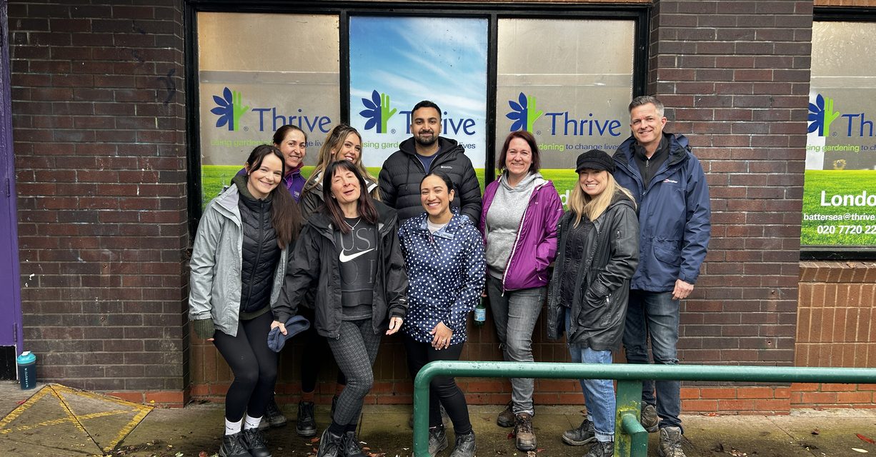 Entec Si team pose in front of the Thrive office.