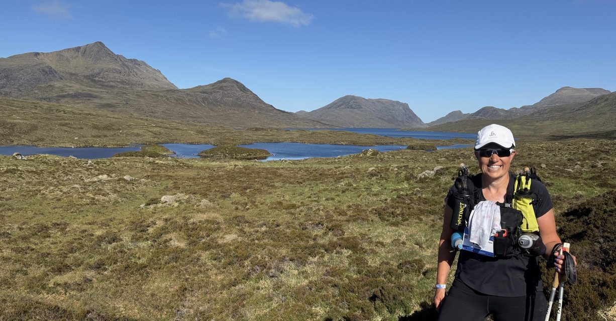 Sarah Towers in front of mountains on ultra-marathon