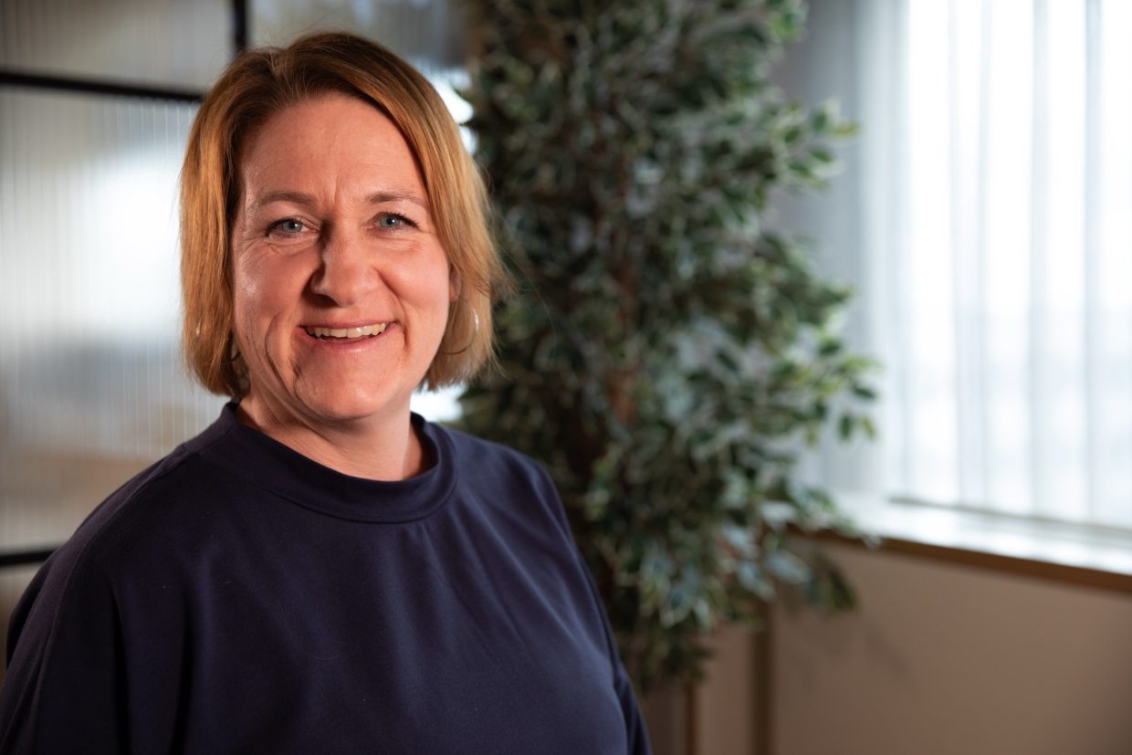 Company culture specialist Nadine Kubalek looks into the camera.