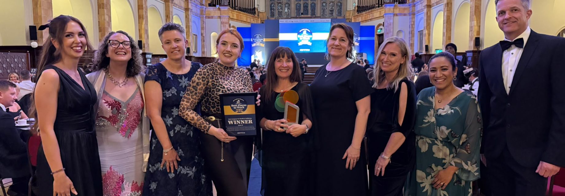 Team receiving Best Workplaces Award